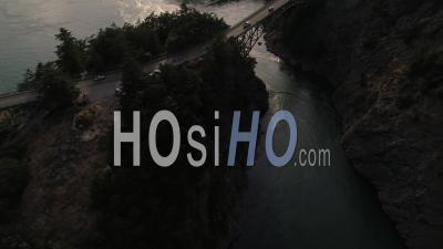 People In Cars Driving Across Puget Sound Ocean Water On Deception Pass Bridge. Deception Pass Washington Usa - Video Drone Footage