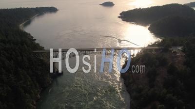 One Driver On Deception Pass Bridge In Washington State Cruising Along At Golden Hour In San Juan Islands - Video Drone Footage