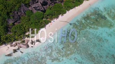 Overhead Aerial View Of Beautiful Source D'argent Beach In La Digue – Seychelles - Video Drone Footage
