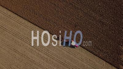 Aerial View, Tractor Plowing Fields, Preparing Land For Sowing - Video Drone Footage