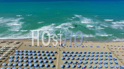 Beach Umbrellas And Beautiful Beach Aerial View In Summer Season Pisa Italy - Video Drone Footage