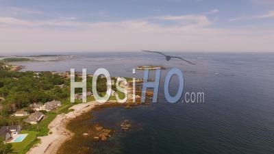 Flying Low Over Coastline Homes Panning. Maine - Video Drone Footage