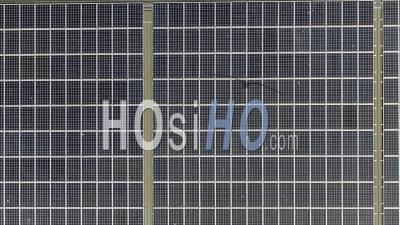 Large Arrary Of Rooftop Solar Panels. Uk - Video Drone Footage