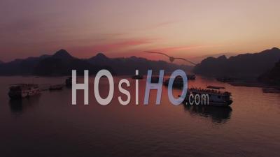 Group Of Cruise Ships Ha Long Bay Sunset Vietnam - Video Drone Footage