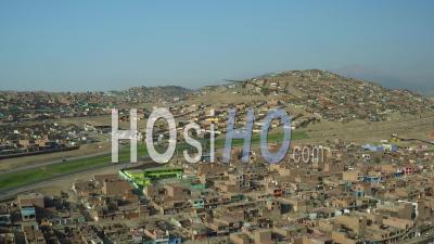 Ventanilla Peru Flying Low Over Urban Poverty Hillside Housing Area In Mi Peru. - Video Drone Footage