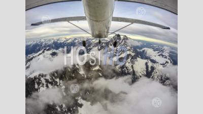 Point Of View Of Airplane Exploring The Coastal Mountains Of British Columbia - Aerial Photography