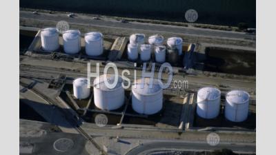Oil Tanks Next To Sea With Railroad Tracks. - Aerial Photography