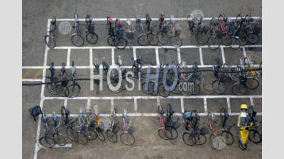 Bicycles Parked In Rows On A City Street In Datong, Shanxi, China. - Aerial Photography