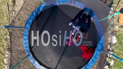 Video Drone Footage Of Mother With Her Daughter Jumping On Trampoline