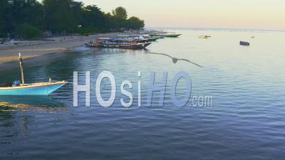 Boats Along Coast Of Gili Air Island - Video Drone Footage