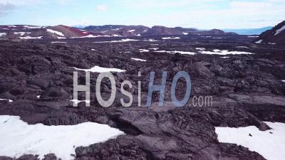 Aerial View Over Vast Lava Fields And Snow Near Askja Iceland - Video Drone Footage