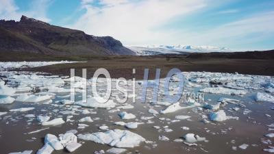 Aerial View Of The Vatnajokull Glacier At Fjallsarlon, Iceland, Suggests Global Warming And Climate Change - Video Drone Footage