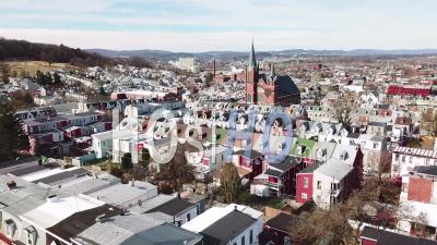 Aerial View Of Typical Pennsylvania Town With Rowhouses And Large Church Or Cathedral Distant, Reading, Pa - Video Drone Footage
