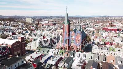 Aerial View Of Typical Pennsylvania Town With Rowhouses And Large Church Or Cathedral Distant, Reading, Pa - Video Drone Footage