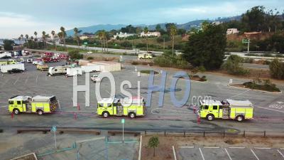 Aerial View Of Firefighters In Fire Trucks Lining Up For Duty At A Staging Area During The Thomas Fire In Ventura, California In 2017 - Video Drone Footage