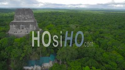 Spectacular Aerial View Over The Treetops And Tikal Pyramids In Guatemala - Video Drone Footage