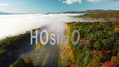 Aerial View Over A Highway Through The Fog In Fall In New England - Video Drone Footage