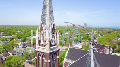 Aerial View Around A Church And Steeple On The South Side Of Chicago, Illinois - Video Drone Footage