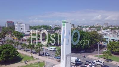 Aerial View Around A Statue With The Capital Of The Dominican Republic, Santo Domingo In Background - Video Drone Footage