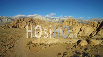 Aerial View At Sunset Over The Alabama Hills Outside Lone Pine California With Mt. Whitney And Sierras Background - Video Drone Footage
