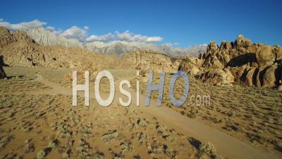 Aerial View At Sunset Over The Alabama Hills Outside Lone Pine California With Mt. Whitney And Sierras Background - Video Drone Footage