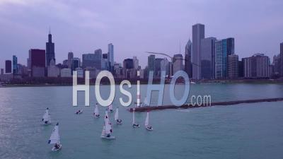 Aerial View Over Sailboats On Lake Michigan With The City Of Chicago In The Distance - Video Drone Footage