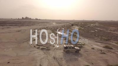 Aerial View Over Two 4x4 Jeeps Traveling Across The Deserts Of Djibouti Or Somalia - Video Drone Footage