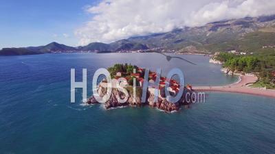 Aerial View Over The Beautiful Sveti Stefan Island In Montenegro - Video Drone Footage