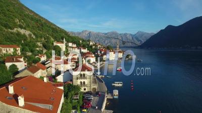Aerial View Of An Attractive Village On The Shores Of Boka Bay, Montenegro - Video Drone Footage