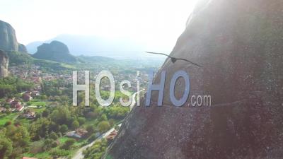 Aerial View Of Climbers Ascend A Sheer Rocky Cliff Face In Meteora, Greece - Video Drone Footage