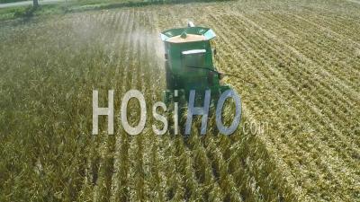 Aerial View Over A Rural American Farm With Corn Combine Harvester At Work - Video Drone Footage