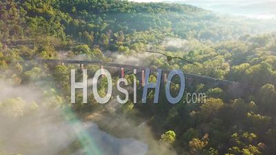 Aerial View Over A Steel Railway Trestle In The Fog In West Virginia Appalachian Mountains - Video Drone Footage