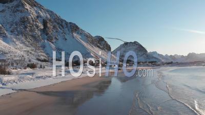 Snowy Beach On A Sunny Day In The Lofoten Islands - Video Drone Footage
