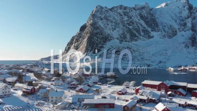 The Fishing Village Of Reine From Above, Covered By Snow - Video Drone Footage