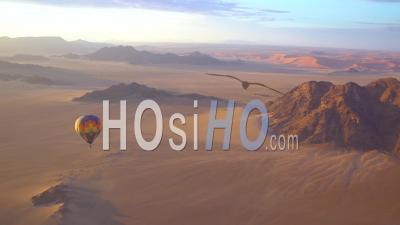 Hot Air Balloons Fly In The Namib Desert In Namibia - Video Drone Footage