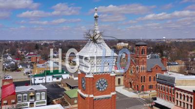 Aerial View Of A Tree Growing Out Of The Top Of A County Courthouse In Greensburg, Indiana - Video Drone Footage