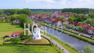 Aerial View Over Canal And Small Town Of Damme, Belgium And Historic Windmill - Video Drone Footage