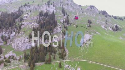 Aerial View Of A Bungee Jumper Diving From A Cable Car In Switzerland - Video Drone Footage