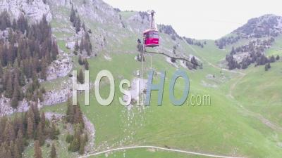 Aerial View Of A Bungee Jumper Diving From A Cable Car In Switzerland - Video Drone Footage