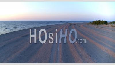 Slow Flying Over Road In Coastal Landscape. Gotland Sweden - Video Drone Footage