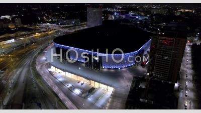 Friends Arena Lit In Blue At Night In Stockholm, Sweden, Drone View