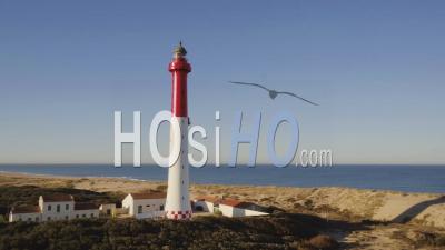 Low Level Turning Around La Coubre Lighthouse With Ocean Video Drone Footage