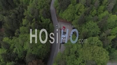 Car Driving On A Mountain Forest Road - Video Drone Footage