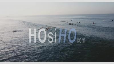 Two Girls On Surfboards In Sunrise - Aerial Video By Drone