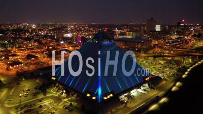 The Memphis Pyramid, Hernando De Soto Bridge And Downtown Memphis Cityscape At Dusk - Aerial Video By Drone