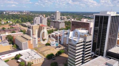 Buildings In The Downtown Business District Of Jackson, Mississippi With State Capitol Distant - Aerial Video By Drone