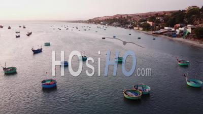 Vietnamese Fishing Boats Parked In Bay During Sunset - Aerial Video By Drone