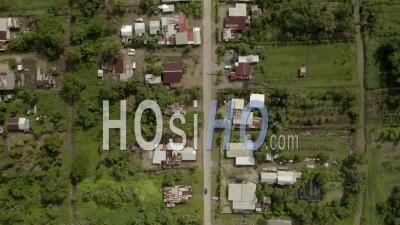 Remote Suburban Town On Edge Of Rainforest In Suriname, Aerial - Video Drone Footage