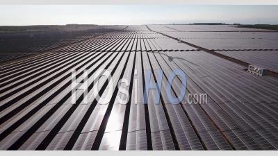 Flying Over Reflective Solar Panels - Video Drone Footage