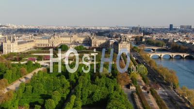 Louvre Museum, Pyramid And Tuileries Garden During The Quarantine Of Paris, High Focal, Seen By Drone